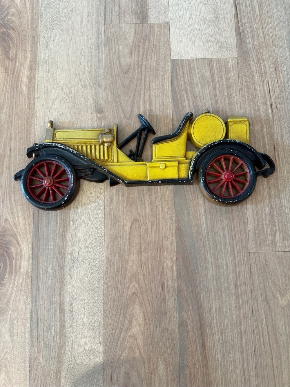 Yellow Vintage-Style Toy Car Wall Accent with Red Wheels